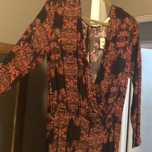 Gorgeous long sleeve jumpsuit w/flair bottom